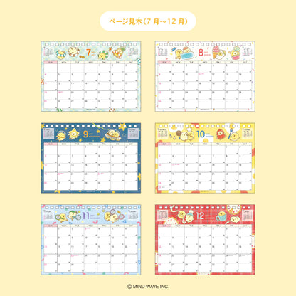 Six monthly calendar pages from July to December, decorated with cute cartoon characters and colorful borders, arranged in a 2x3 grid on a pale yellow background. Japanese text at the top reads 'ページ見本(7月～12月)', and a copyright notice for MIND WAVE INC.